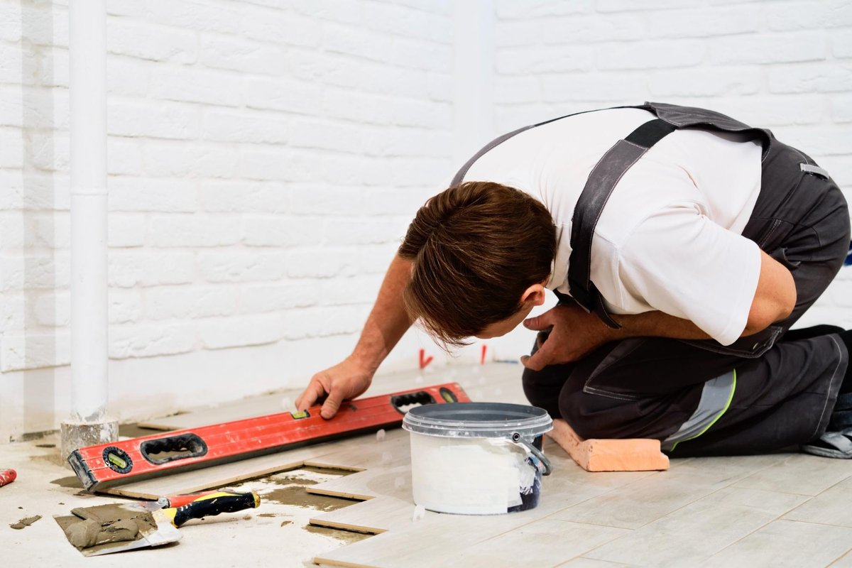 Man installing flooring