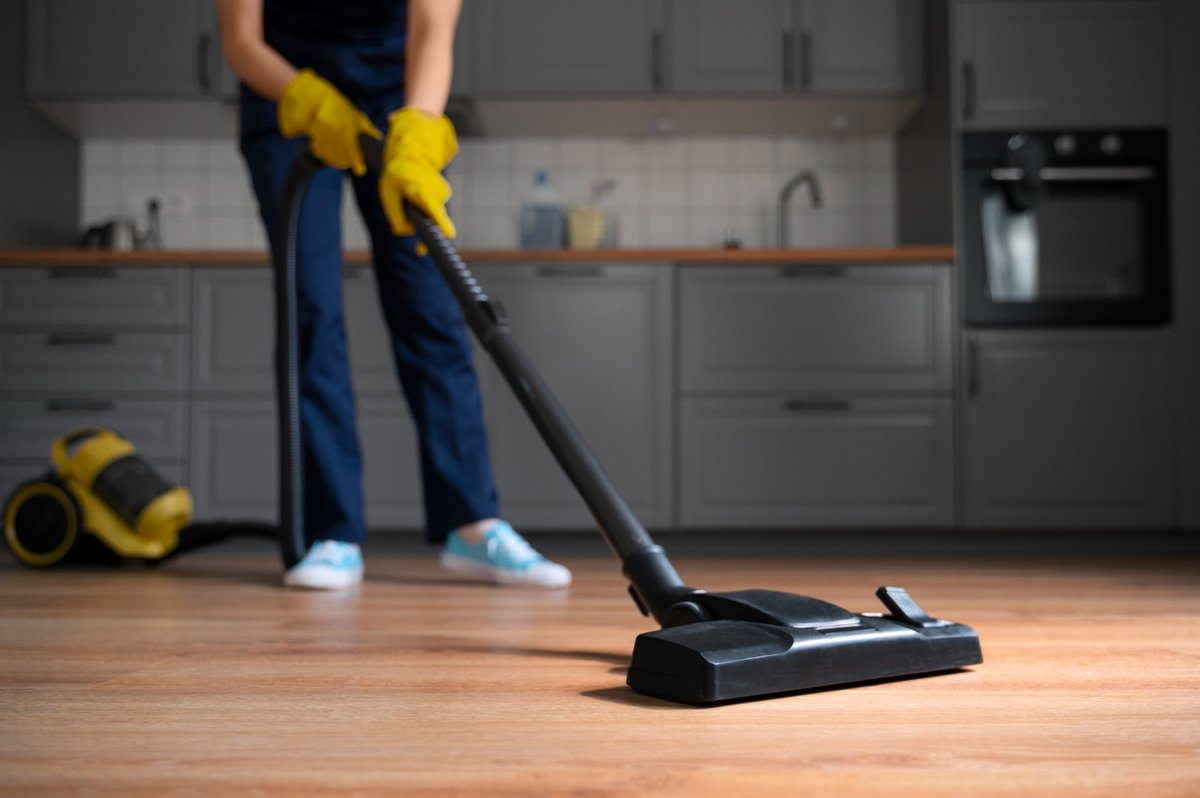 Front view woman cleaning home