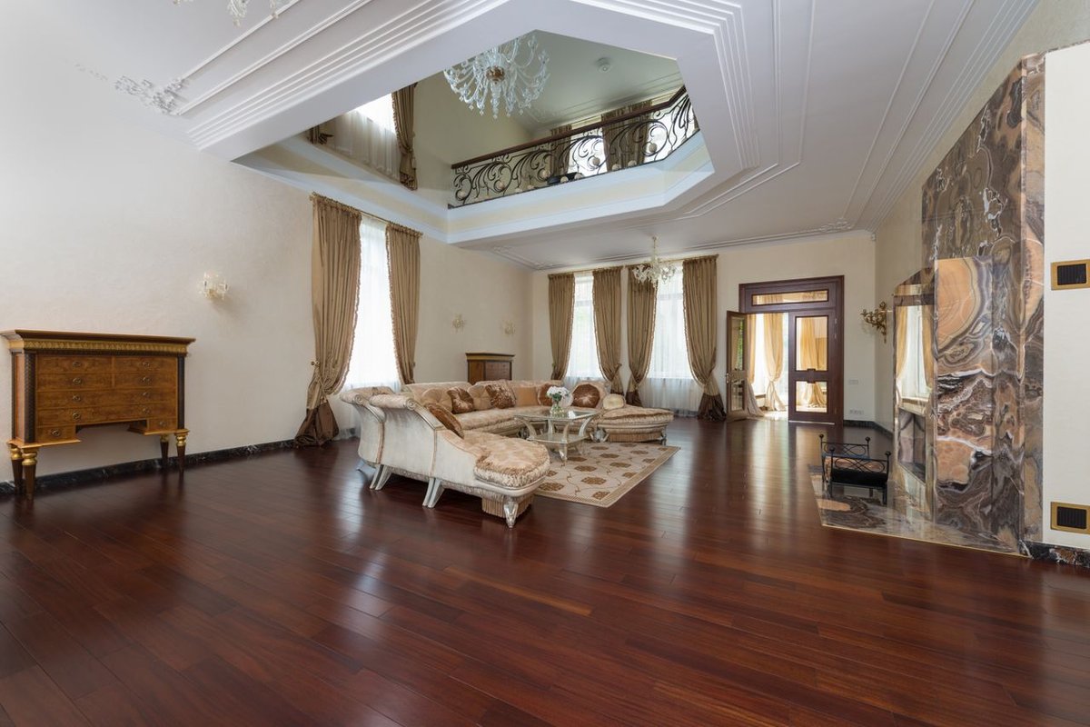 Spacious and luxurious living room with classic decor and elegant furnishings.