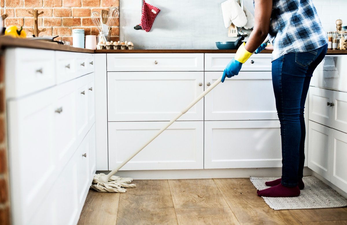 A Black person doing house chores