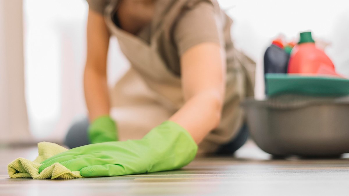 Close-up woman cleaning floor
