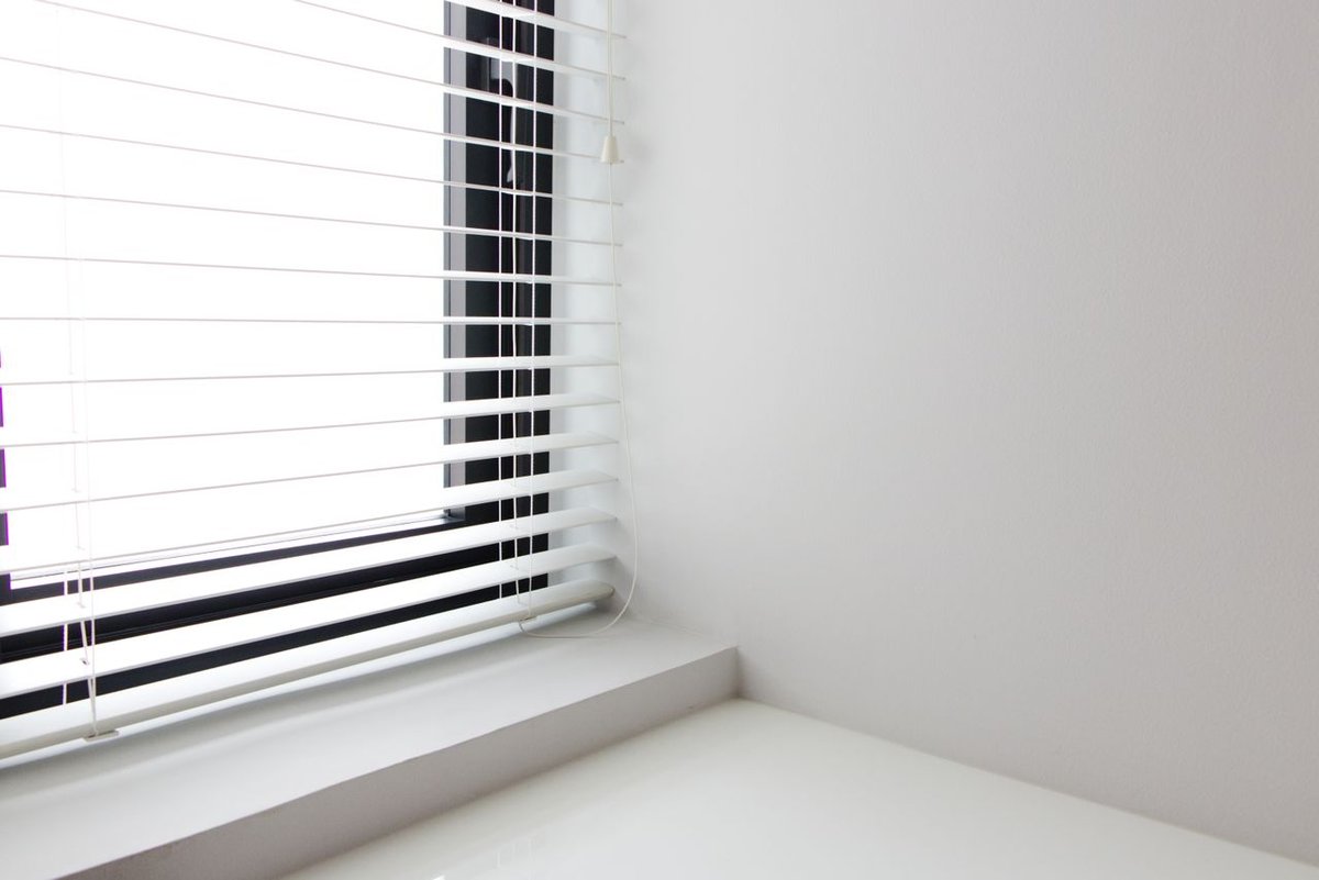 a white window with white blinds