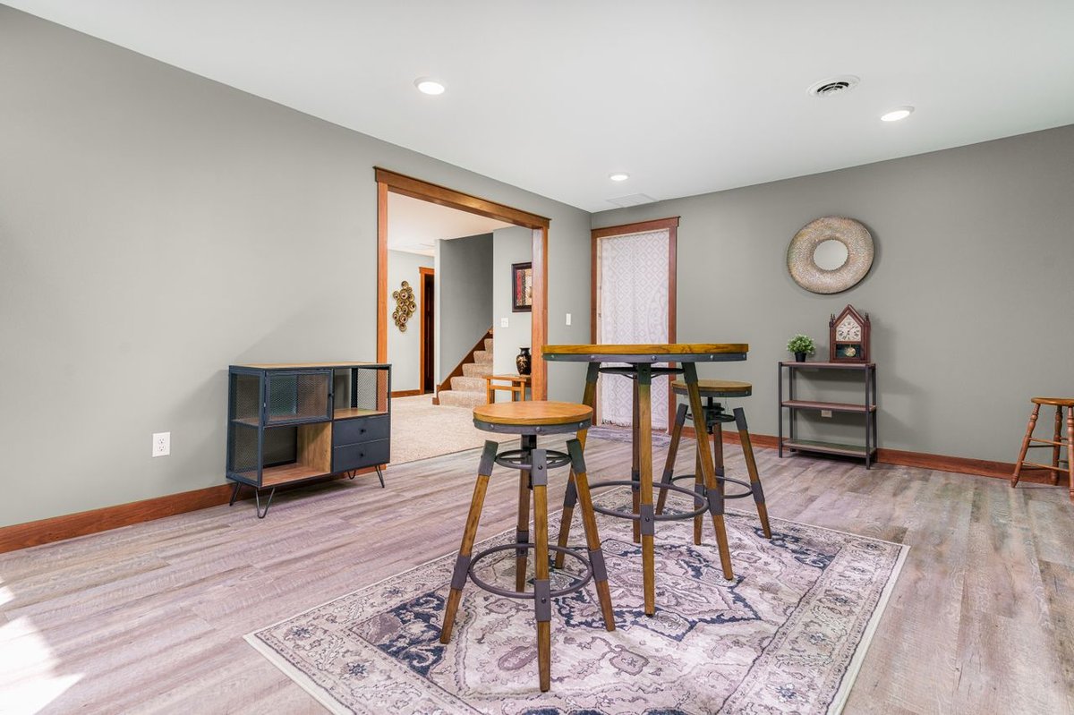 A basement with laminate flooring