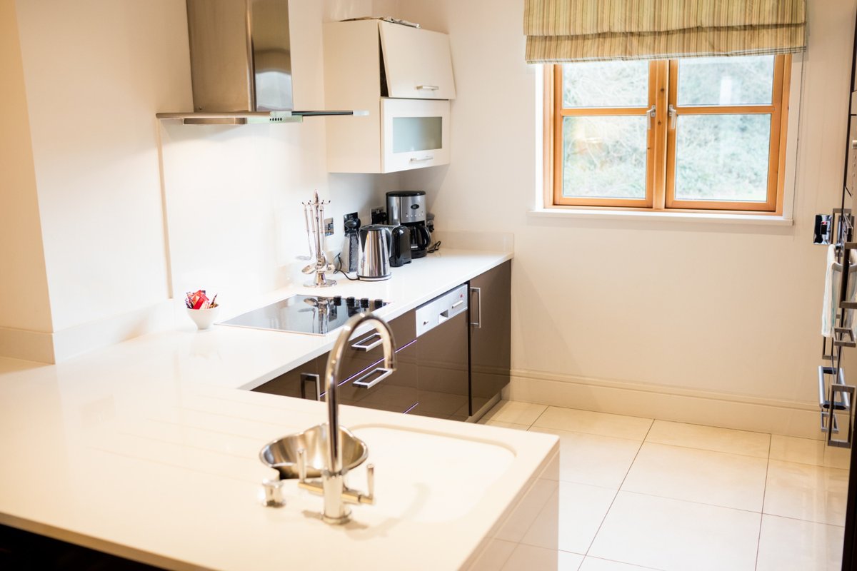 View of empty kitchen with ceramic tiles