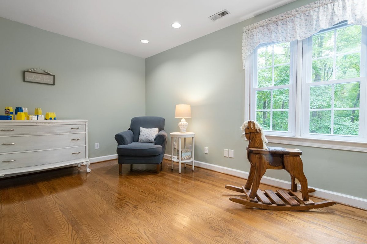 Inviting living room featuring a classic wooden rocking horse and elegant decor.