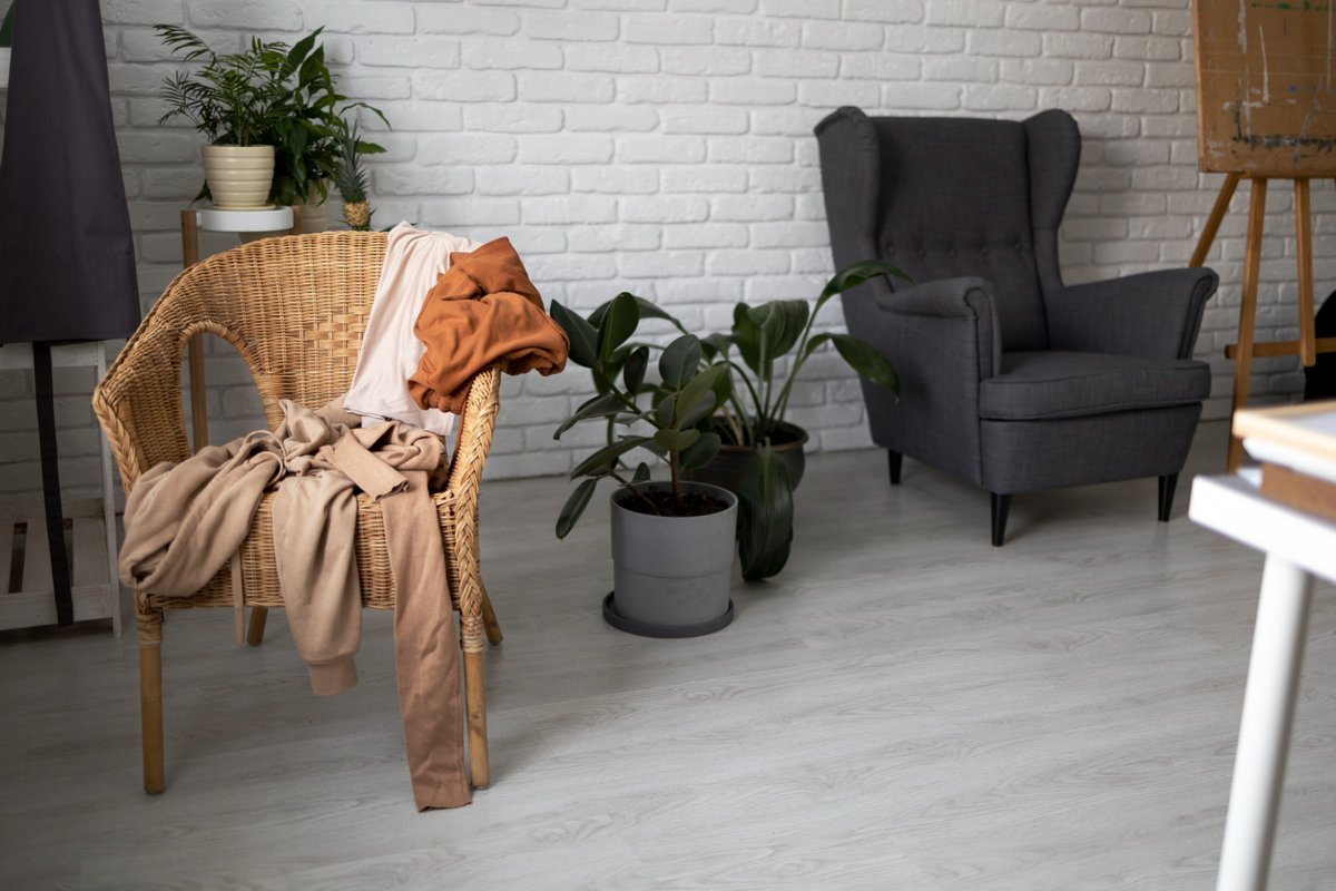 Chair with clothes in living room high angle