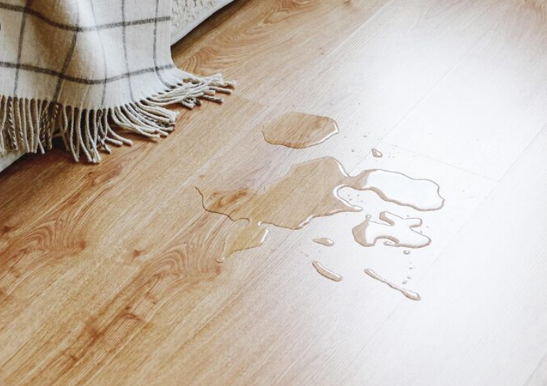 Water on the laminated floor in the living room